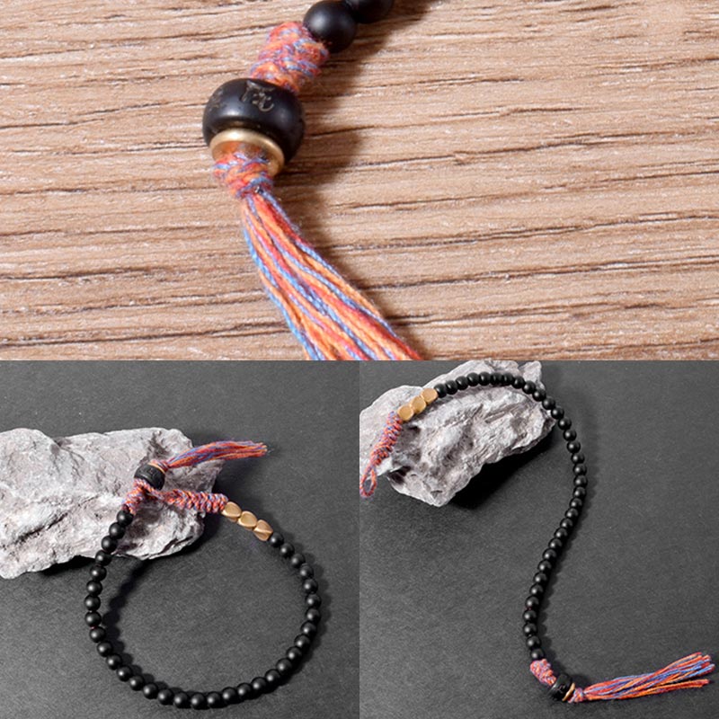 Braccialetto fatto a mano in onice nero tibetano con nappa Buddha Stones - Image 7